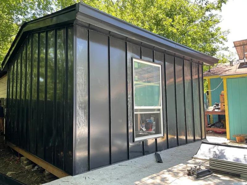 Black standing seam metal wall panels for Metal Roof Installation in Grandville